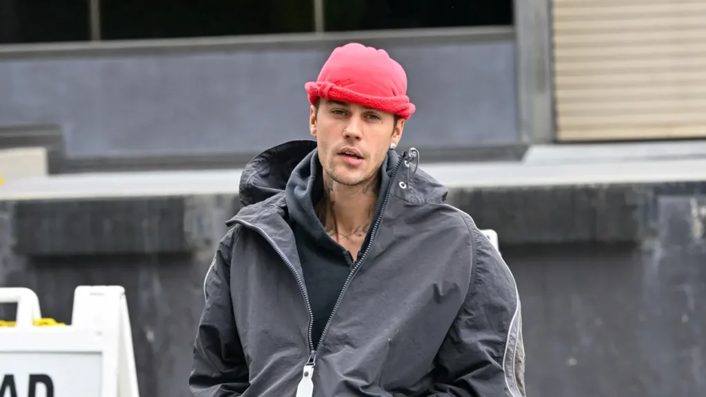 a man wearing a red hat